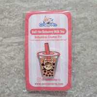 An enamel pin design featuring a cute bunny in boba milk tea.